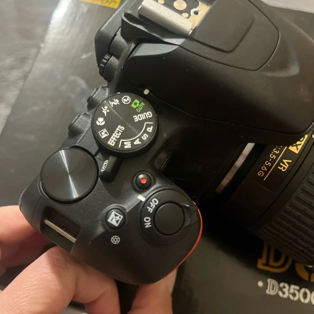 Nikon D3500 DSLR Camera with Black and Gold Accents